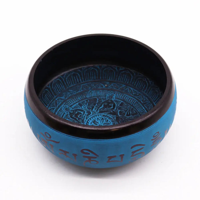 Blue mantra five earth powder singing bowl with intricate engraved designs and sanskrit mantras around the rim