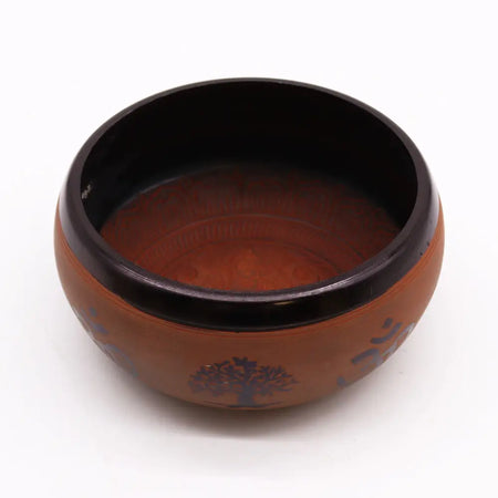 Earth powder singing bowl made of clay with a glossy black rim and dark tree of life motifs for clay om buddha use