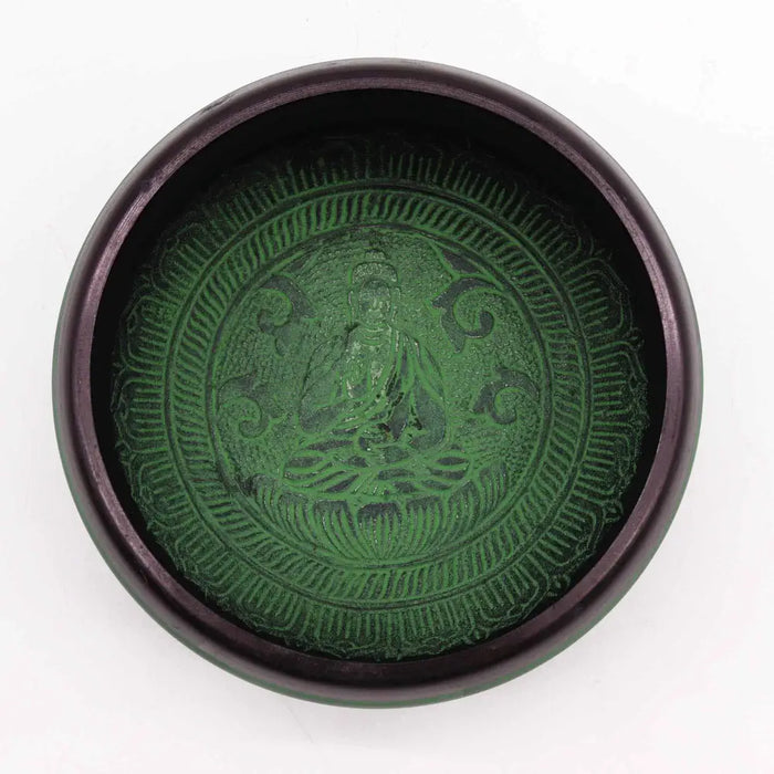 Dark green earth powder singing bowl with engraved mandala buddha and intricate ornate patterns on the surface