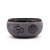 Dark gray metallic earth powder singing bowl with engraved om symbol and flower of life patterns five buddha design