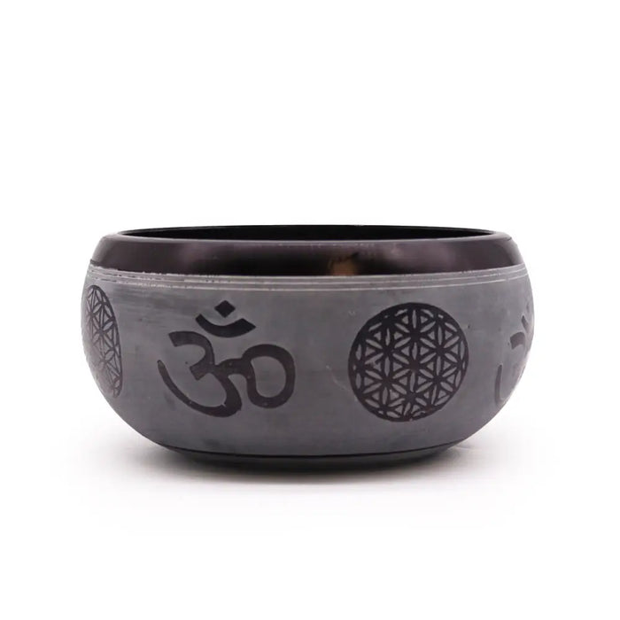 Dark gray metallic earth powder singing bowl with engraved om symbol and flower of life patterns five buddha design