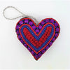 A vibrant purple and red hand-beaded heart hanging ornament with blue border and crystals from five designs collection