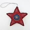 Red beaded star hanging ornament with white embroidery and blue center from embroidered and beaded hanging ornaments five designs