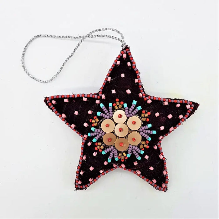 A dark brown star shaped hanging ornament with embroidered beads in red pink turquoise and purple in five designs