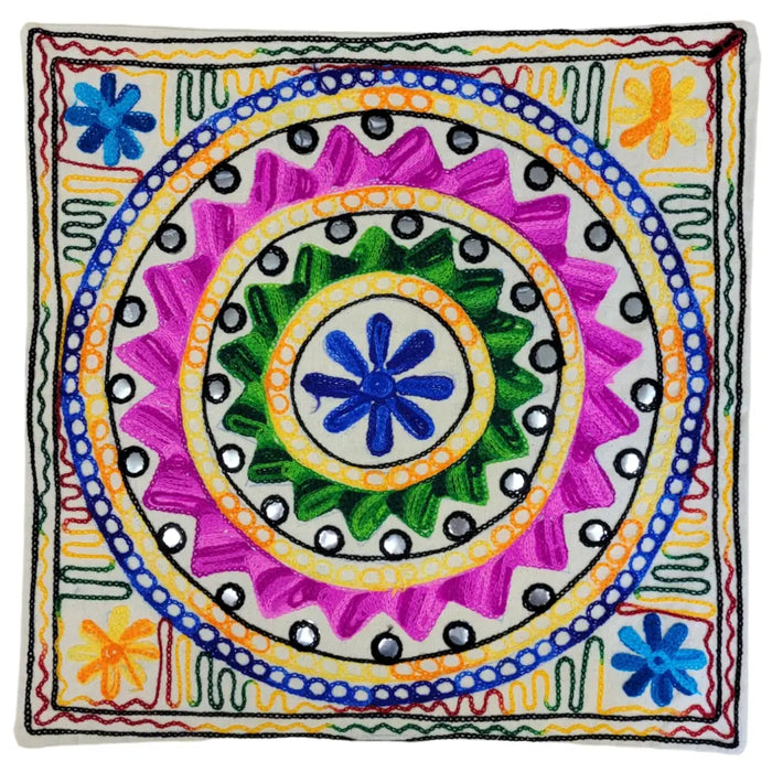 Embroidered cushion cover with vibrant pink green and blue floral circles accented by silver mirror beads for standard cushions