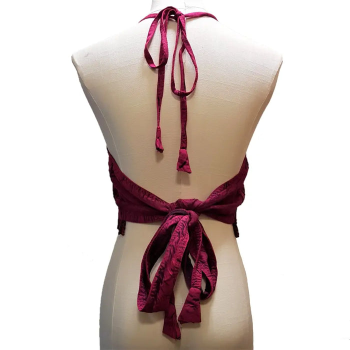 A deep burgundy velvet embroidered halter-neck cropped top with tied-back design and matching fabric ties