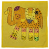 A vibrant indian patchwork cushion cover featuring a yellow embroidered elephant design on a standard cushion