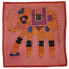 A vibrant indian patchwork cushion cover with an embroidered orange and purple elephant on a pink standard cushion
