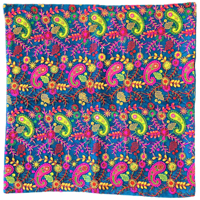 Vibrant blue embroidered velveteen cushion cover with neon pink paisley and floral patterns in standard cushion size