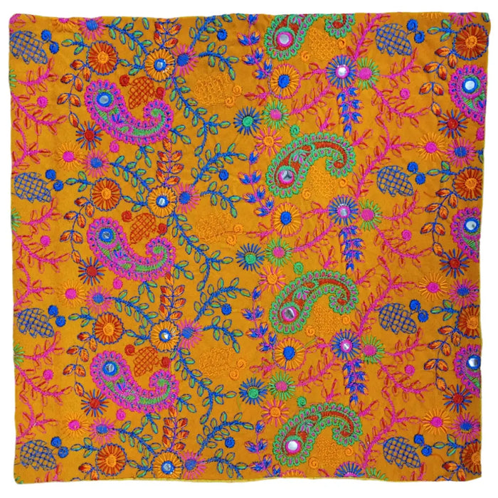 Vibrant orange embroidered velveteen cushion cover with intricate paisley floral patterns and shiny mirror beads