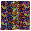 Vibrant embroidered velveteen cushion cover with neon paisley and floral patterns on deep maroon velvet background