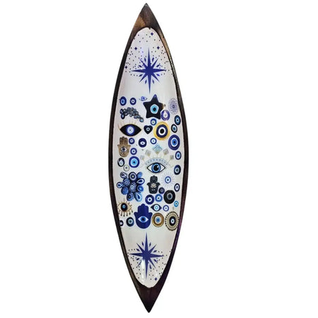 Enamel incense bowl with evil eye design on white surface and mango wood base featuring blue black and gold patterns