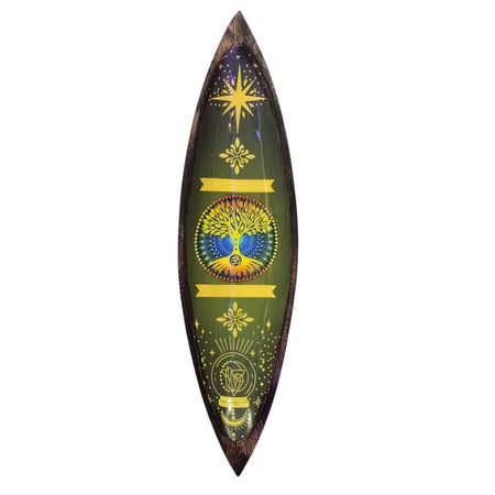 A dark mango wood incense bowl shaped like a surfboard with green resin and gold tree of life and spiritual symbols