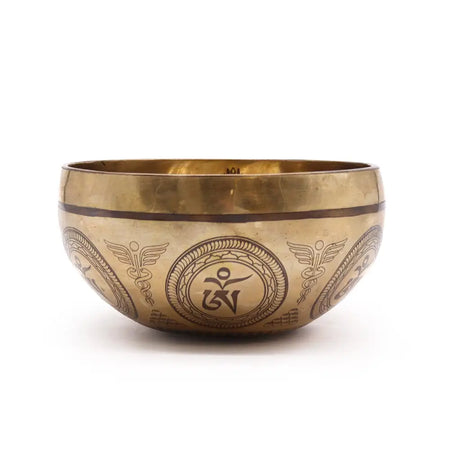 Golden brass tibetan singing bowl with intricate bodhi tree buddha engravings and winged caduceus motifs 16cm