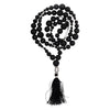 Black lava stone mala necklace with silver buddha bead and tassel for grounding energy and natural lava stone balance