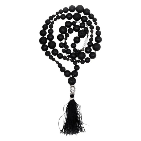 Black lava stone mala necklace with silver buddha bead and tassel for grounding energy and natural lava stone balance