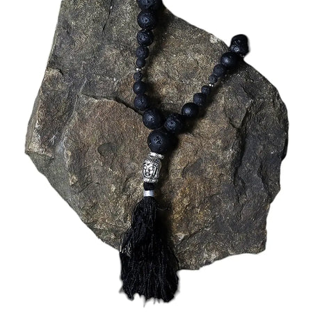 Essence of the volcano necklace with black natural lava stone beads silver buddha head pendant and grounding energy tassel