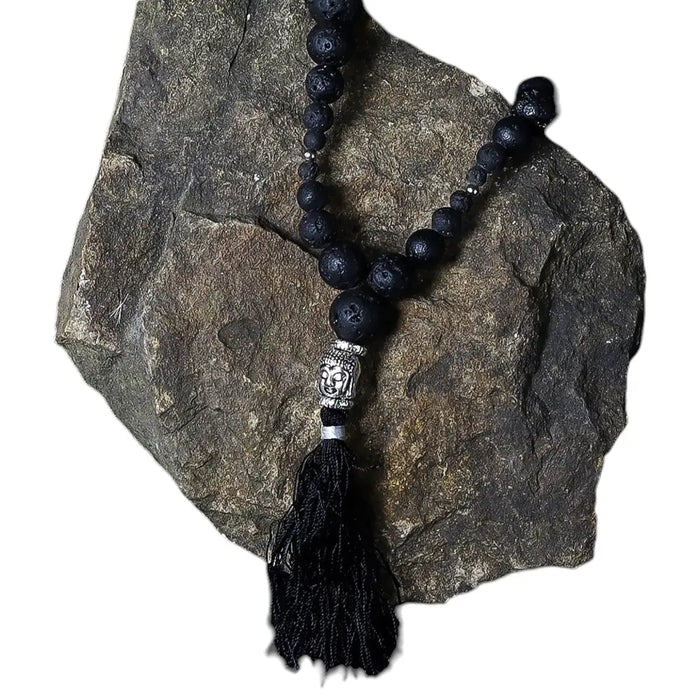 Essence of the volcano necklace with black natural lava stone beads silver buddha head pendant and grounding energy tassel