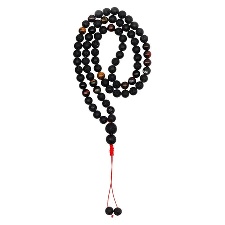 Essence of the volcano necklace with black and gold tiger eye beads and red cord tassel for personal transformation