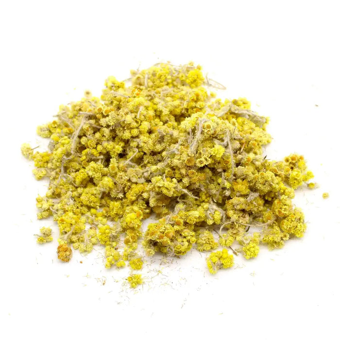 A pile of dried yellow chamomile everlasting flowers with fluffy petals and fine stems weighing 0.5kg