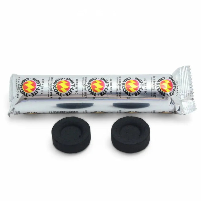 Black circular charcoal tablets in silver foil wrapper labeled snuff-t-lite with red and yellow branding box of 80