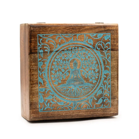 A square extra large mango wood box with a teal engraved meditating figure and tree design in a circular frame