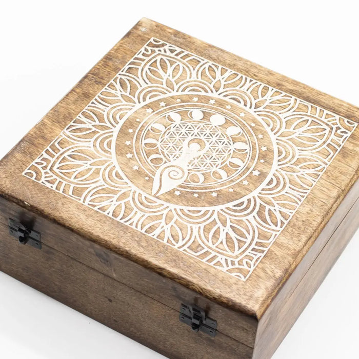 A square mango wood box with a natural brown finish and white laser engraved moon phase goddess mandala design