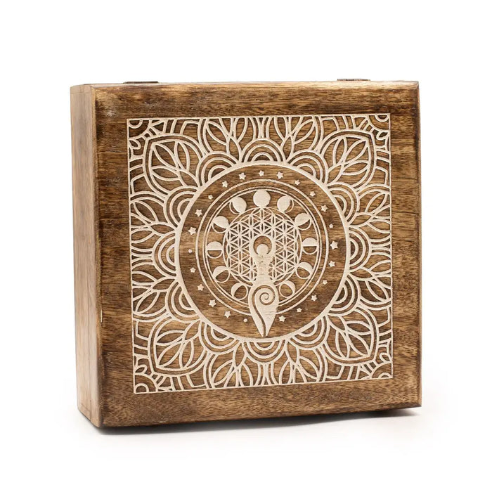 A whitewash square mango wood box with carved mandala design featuring flower of life and moon phases