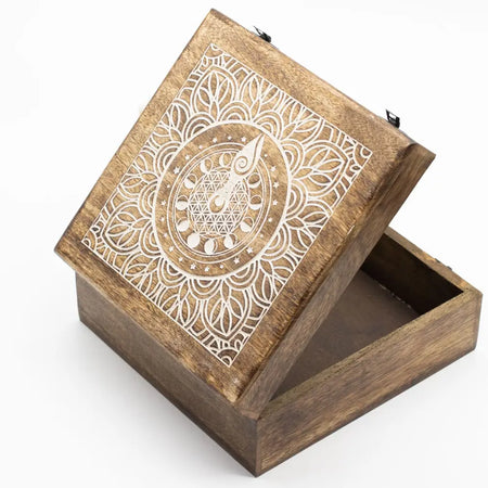A square extra large mango wood box with hinged lid and white carved moon phase goddess mandala on top
