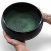 Black tibetan mushroom singing bowl with intricate moss green engravings inside and extra loud sound quality