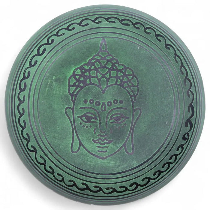 Green stone moss green mushroom singing bowl with engraved buddha face and decorative wavy border patterns