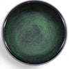 Dark green metal mushroom singing bowl with embossed seated figure and geometric patterns in moss green finish