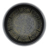Black circular singing bowl with intricate gold embossed floral and five buddha patterns on metal tray