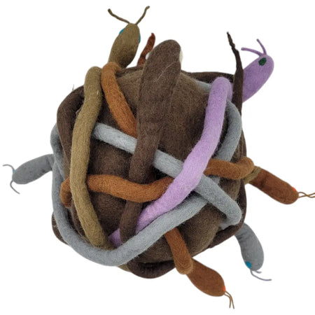 A whimsical felt festival hat with a tangled knot of brown gray purple and orange yarn and small embroidered snakes