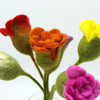 A vibrant felt flowers arrangement featuring roses in assorted colours with red orange yellow pink and green stems