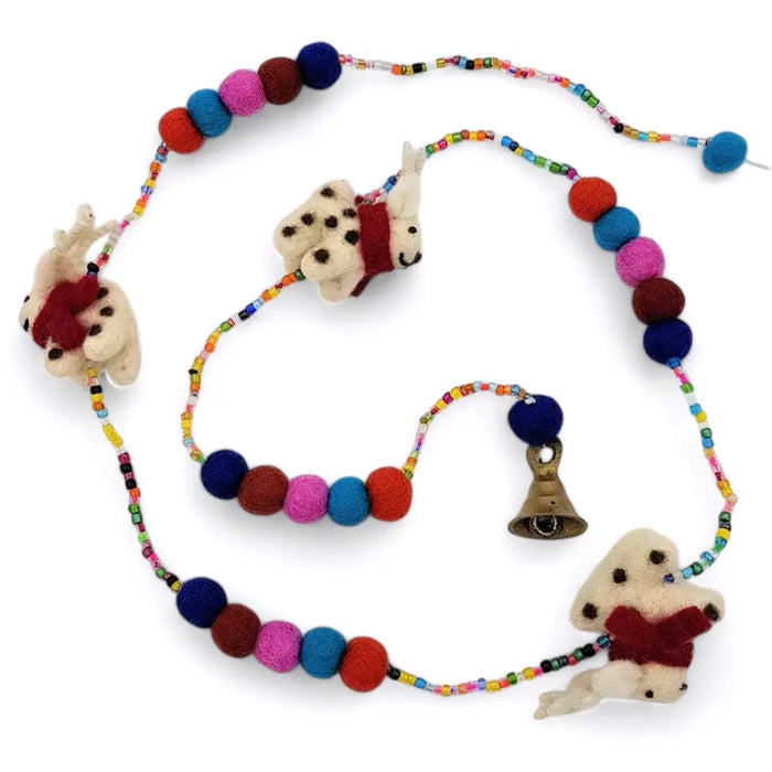 A colorful felt reindeer hanging string with felt beads animal charms and a small bell