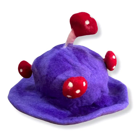 Purple felted mushroom hat with red and white spotted mushrooms called dreamy purple haze