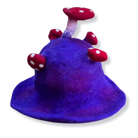 A whimsical purple felted mushroom hat with red and white spotted mushrooms made of felt