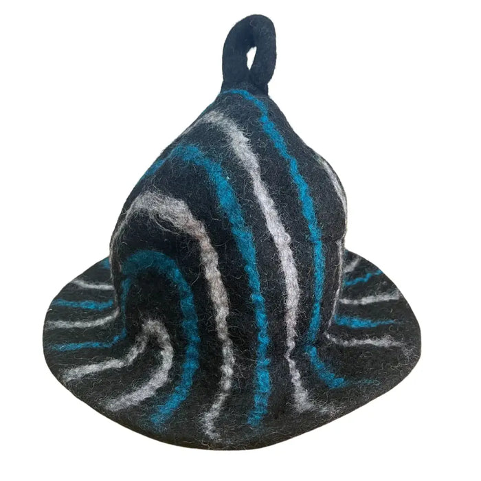 A felted sauna bowl hat with a wide brim and looped top in black teal blue and silver swirling stripes