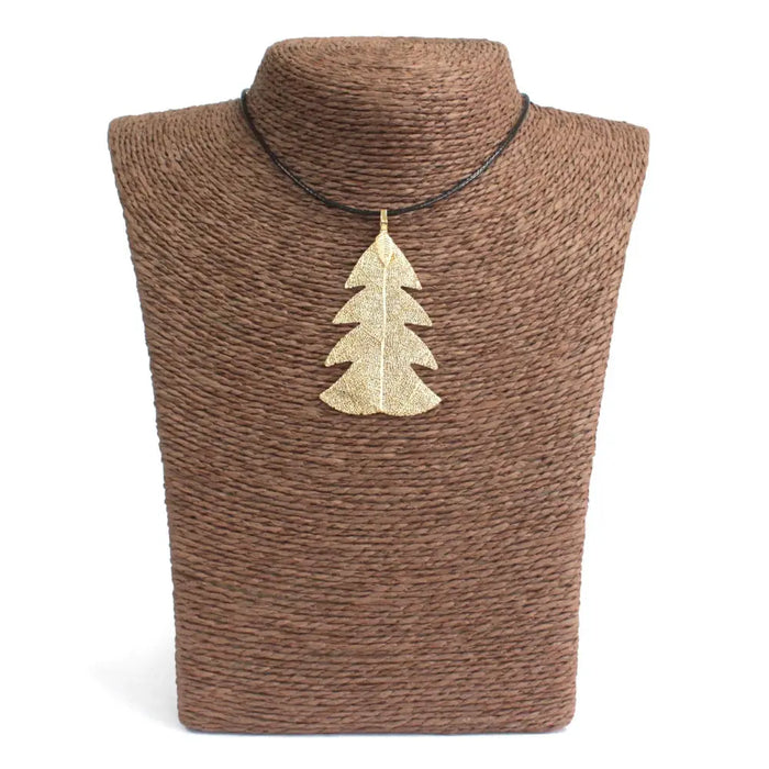 Gold festive fir leaf necklace with textured metallic finish hanging from black cord real leaves jewelry style pendant