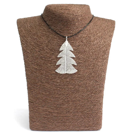 Silver festive fir leaf necklace with textured surface on black cord inspired by real leaves