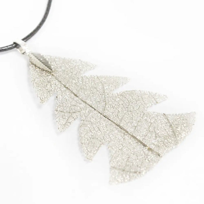 Silver festive fir leaf necklace pendant with textured crackled surface and delicate vein details like real leaves