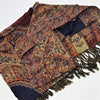 A multi-colored pashmina shawl with intricate paisley and floral patterns in rust navy beige and brown with green fringe