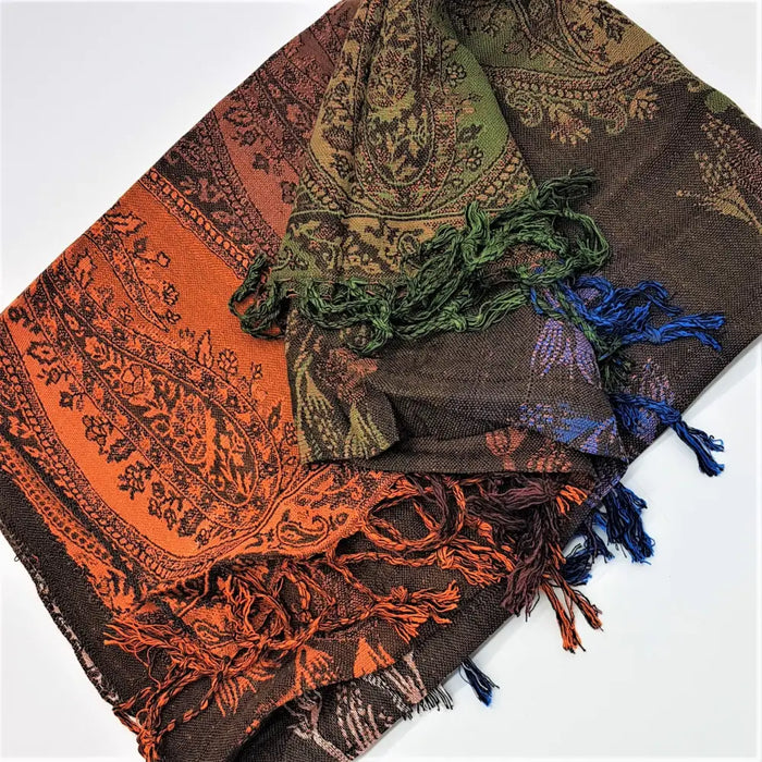 A vibrant multi-colored paisley pashmina scarf with orange green and blue fringes made of fine woven fabric