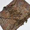 A vintage style brown and beige paisley patterned pashmina scarf with fringed edges in fine woven fabric