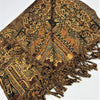A richly patterned earth toned pashmina scarf with floral and geometric designs in brown gold and dark green with fringe