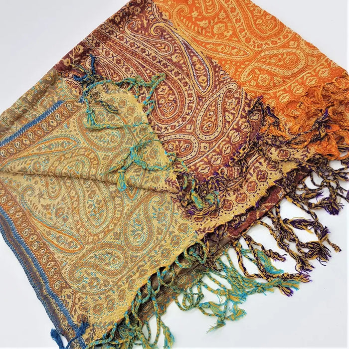 A fine woven pashmina shawl in orange brown and teal with multi toned paisley design and fringed edges