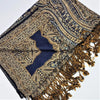 A rich navy blue and gold paisley patterned pashmina shawl with intricate woven details and fringed edges