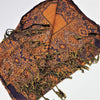 Fine woven pashmina shawl in orange and navy blue with geometric and floral patterns and long textured tassels