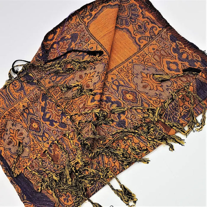 Fine woven pashmina shawl in orange and navy blue with geometric and floral patterns and long textured tassels